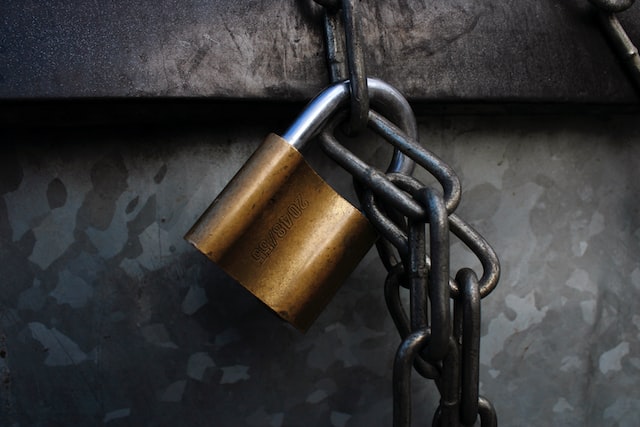 A padlock hanging on a chain